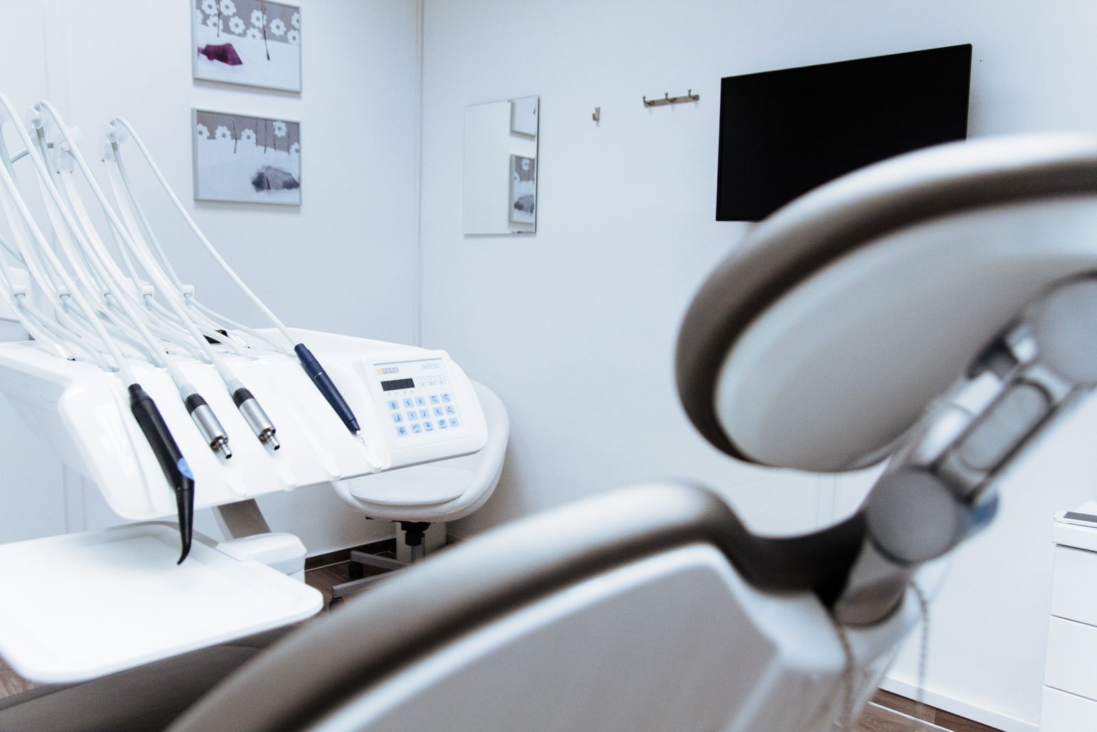 Standard dental treatment room with chair and delivery unit
